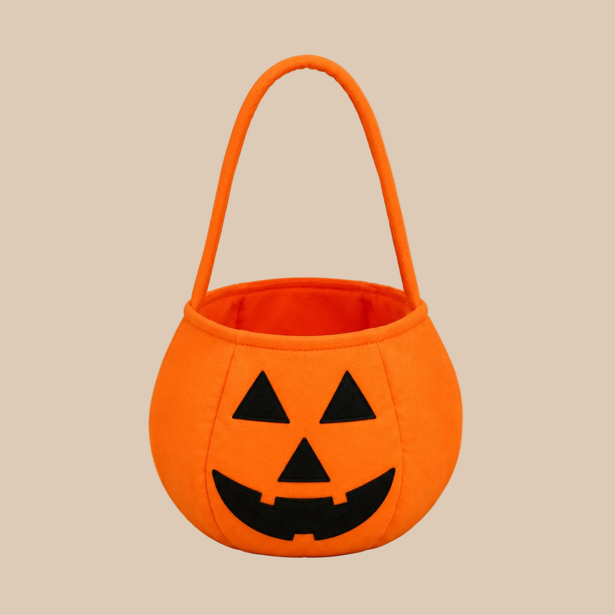 Orange pumpkin candy bucket with a handle, product view