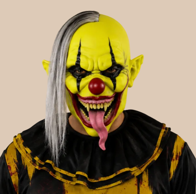 Sinister clown mask with red nose, long tongue and side hair, worn on a model