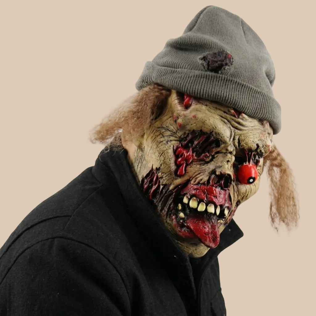 Zombie mask with ragged facial details and a knitted hat, side view