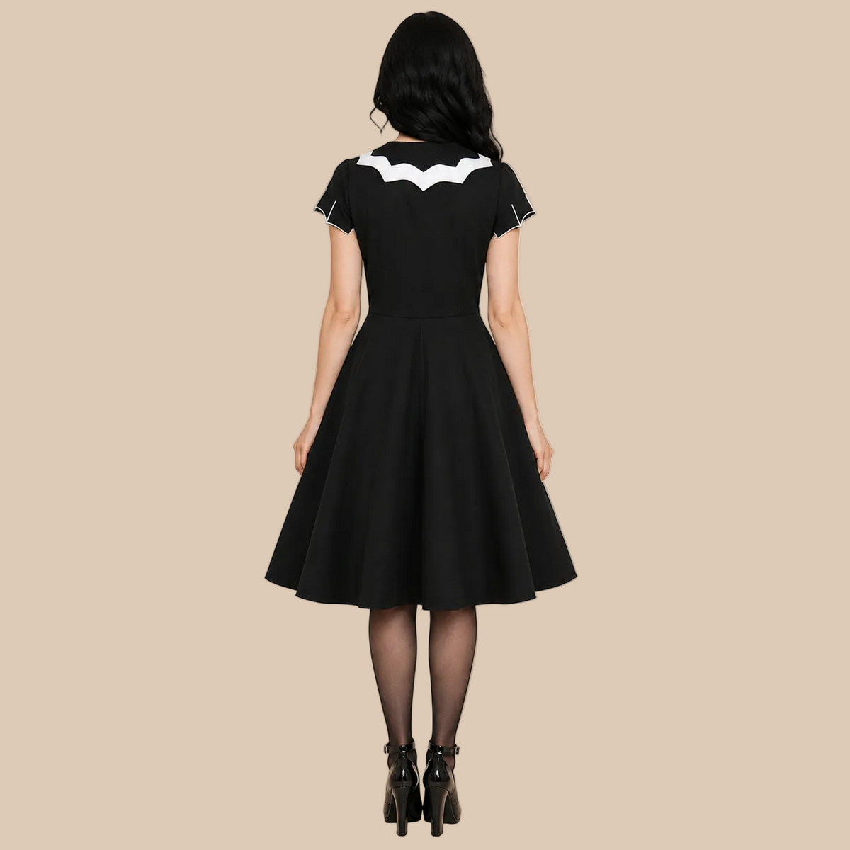 Black bat-pattern dress with a white collar, back view
