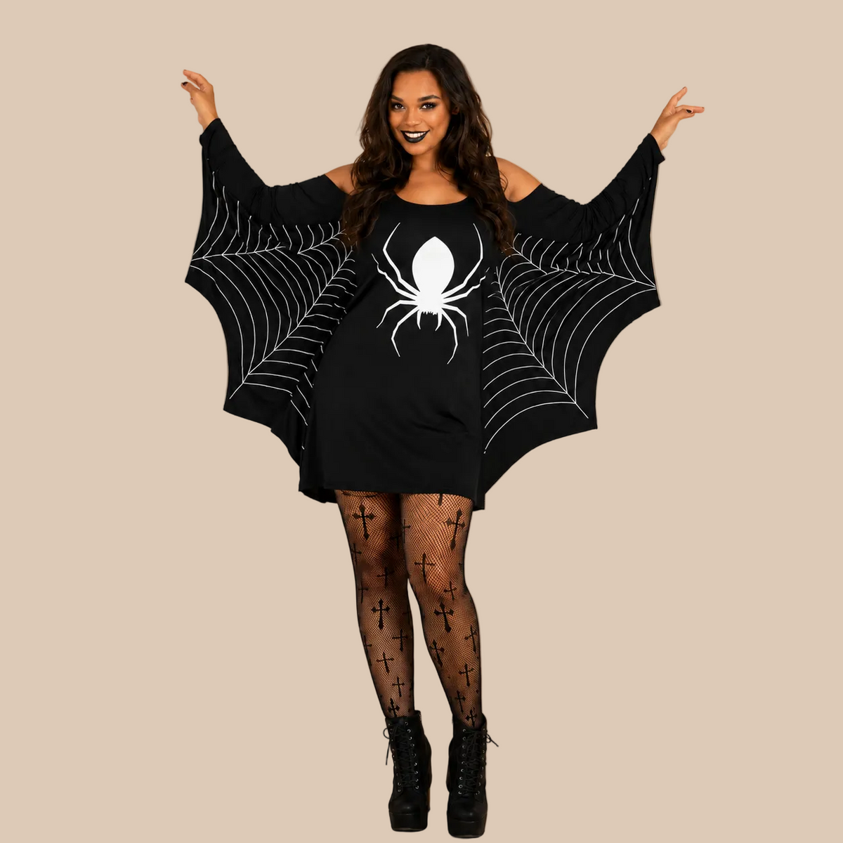 Women’s black dress with a spider and web print, sleeves shown spread out
