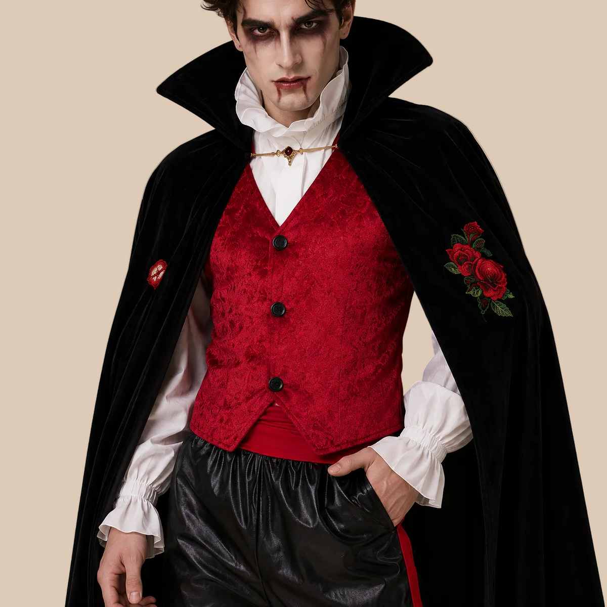 Men’s vampire costume with black cape and red waistcoat, bodice details