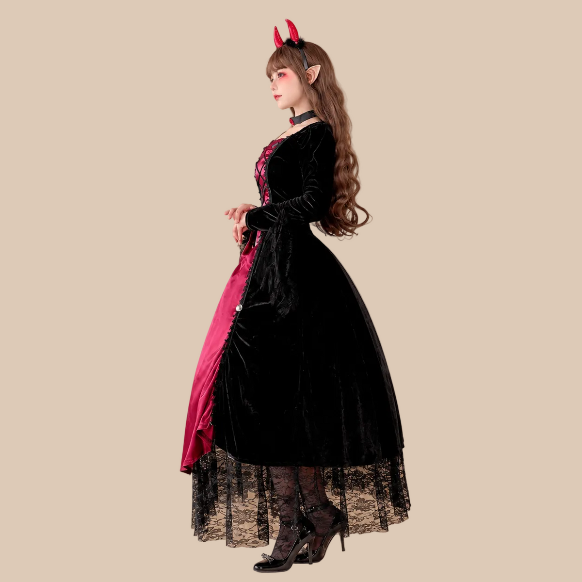 Long red and black devil-style dress with lace hem, side view