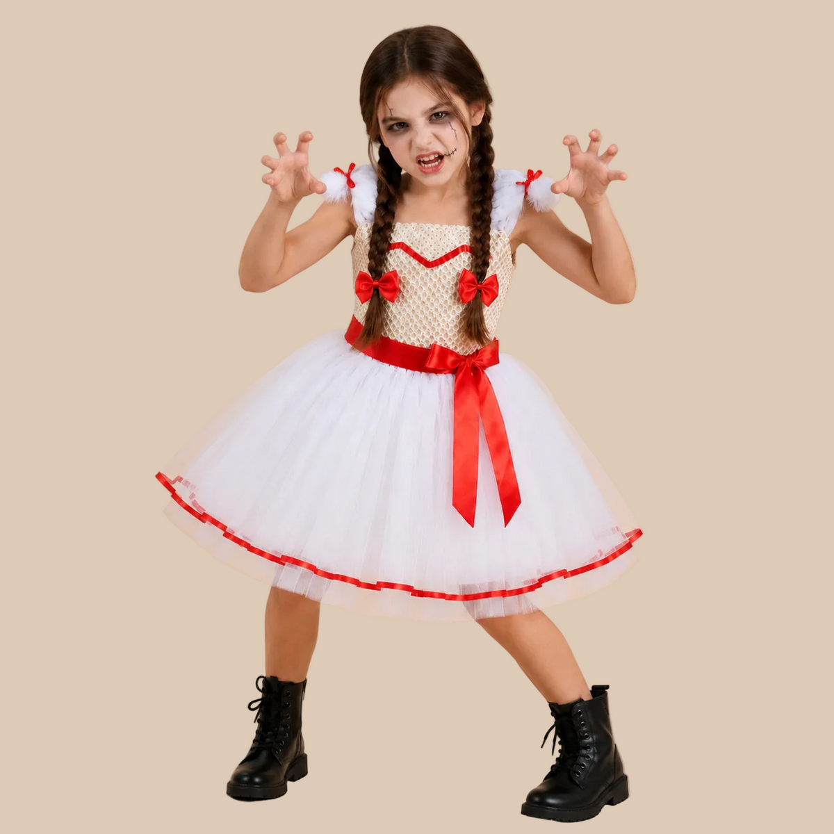 Girl’s white doll-style dress with red trim and sash, front view