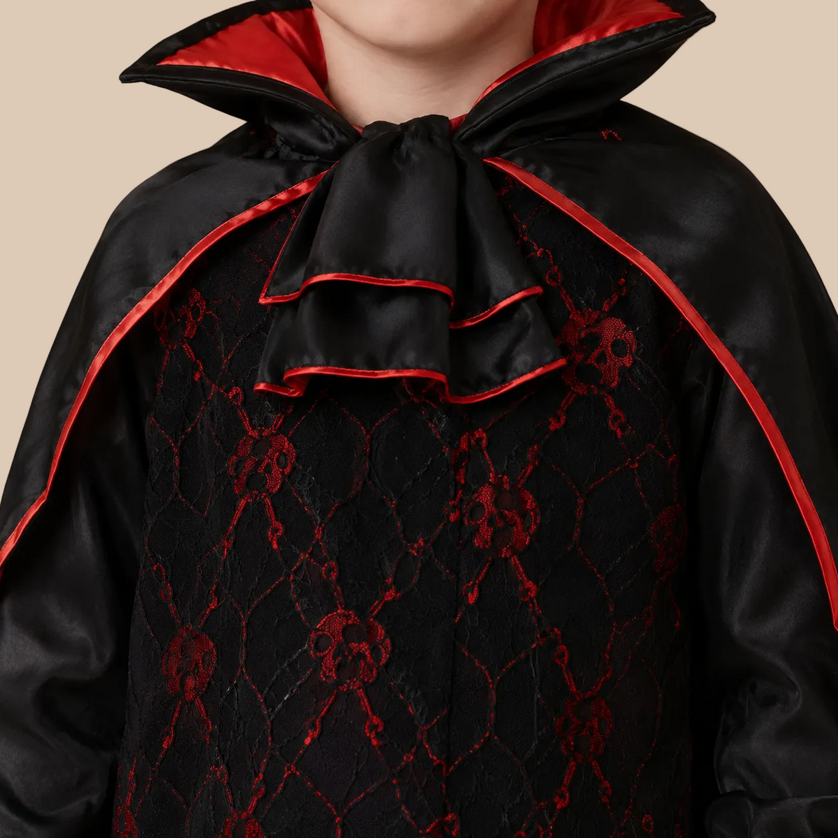 Child’s black vampire outfit with red patterned details, neckline details