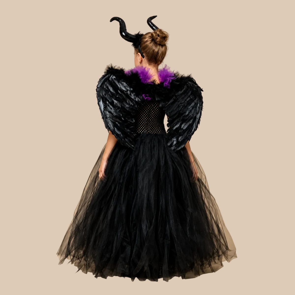 Girl’s black tulle dress with a purple laced bodice, back view