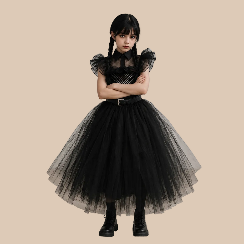 Girl’s black mesh dress with ruffled shoulders and full skirt, front view