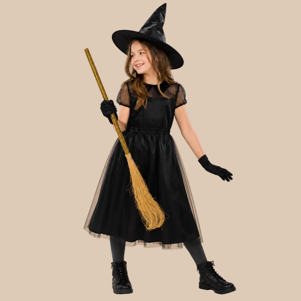 Girl’s black witch dress with sheer shoulders, front view