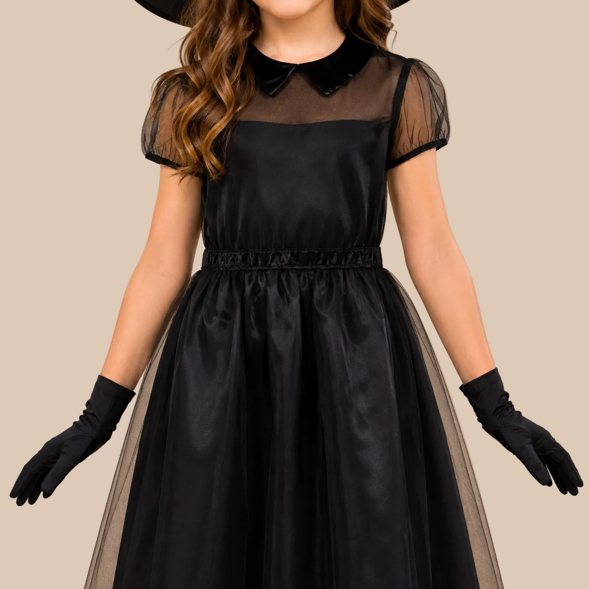 Girl’s black witch dress with sheer shoulders, bodice details