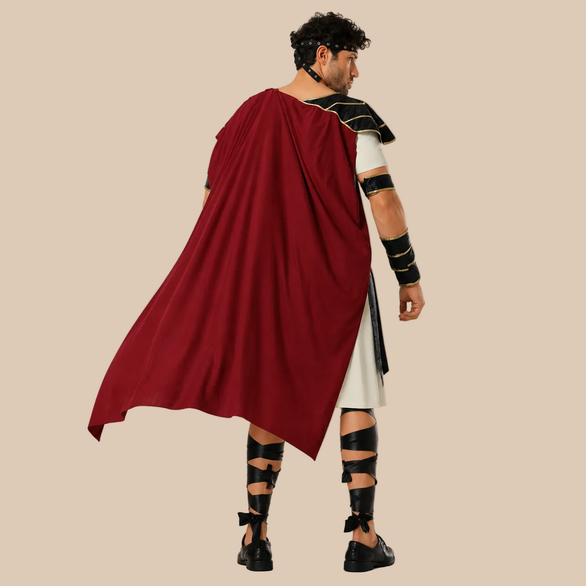 Men’s gladiator costume with decorative armour and red cape, back view