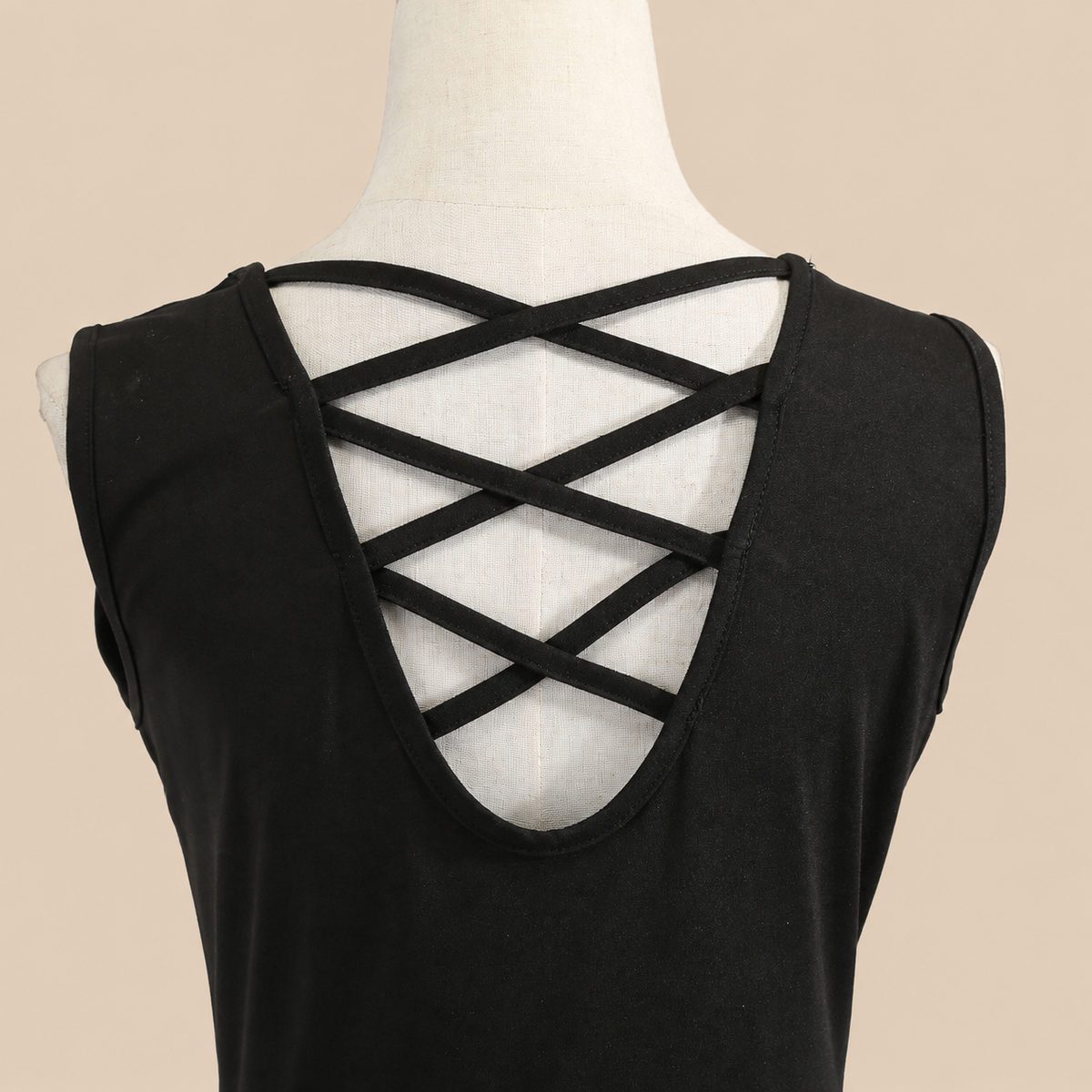 Sleeveless dress with a black bodice and skull-print skirt, neckline details
