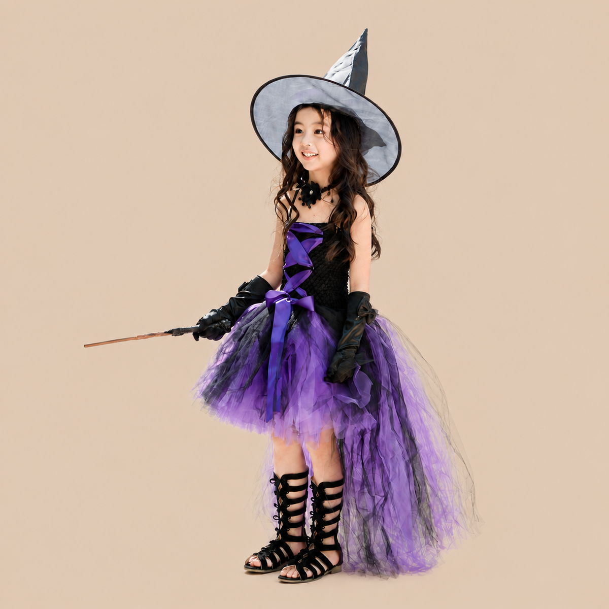 Girl’s purple witch dress with a long trailing skirt, front view
