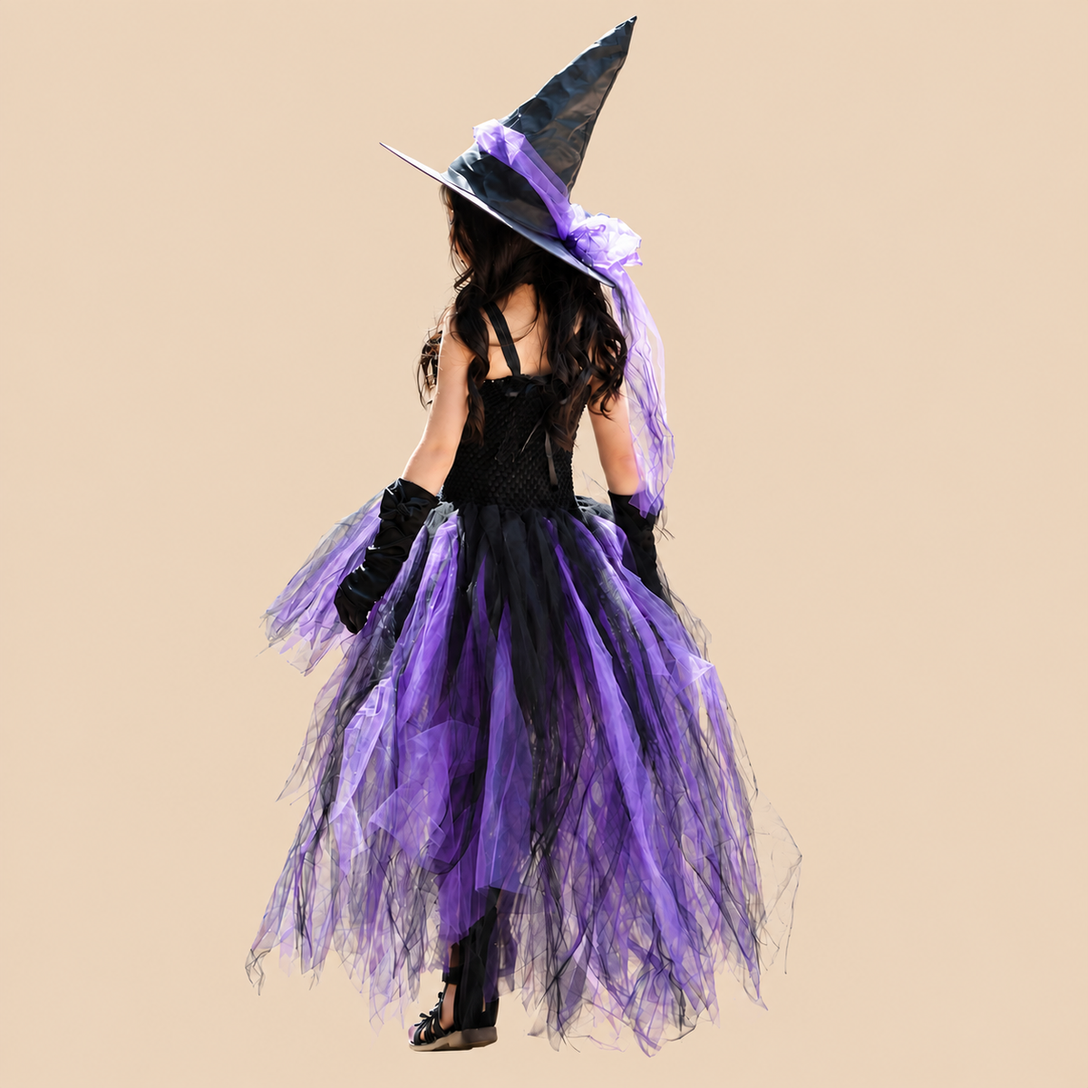 Girl’s purple witch dress with a long trailing skirt, back view
