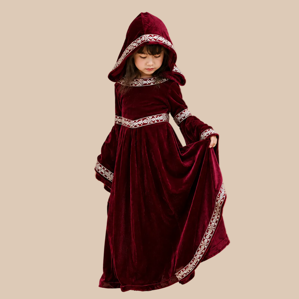Girl’s dark red hooded dress with flared sleeves, alternate front view