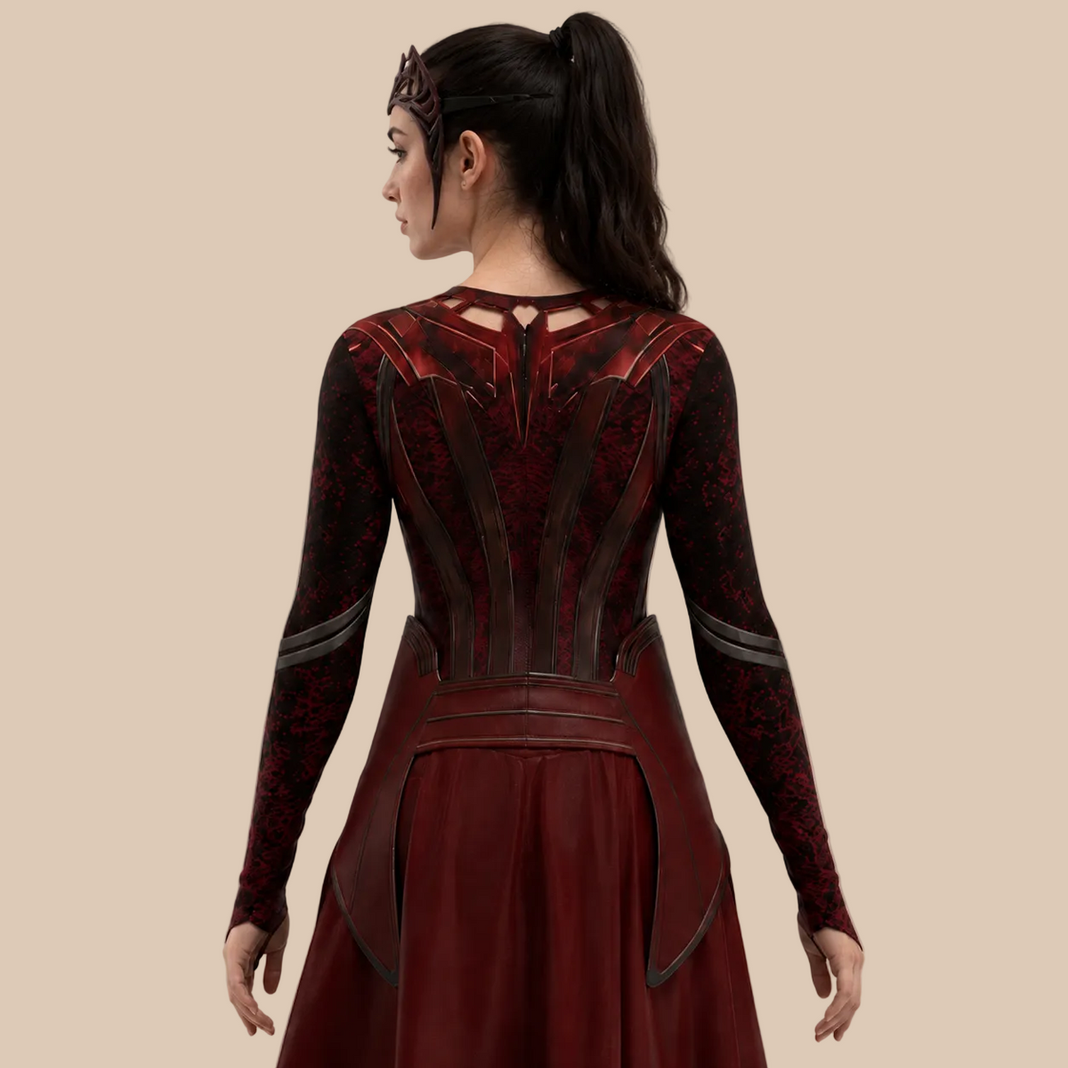Girl’s dark red costume with printed bodice and trailing panels, back view