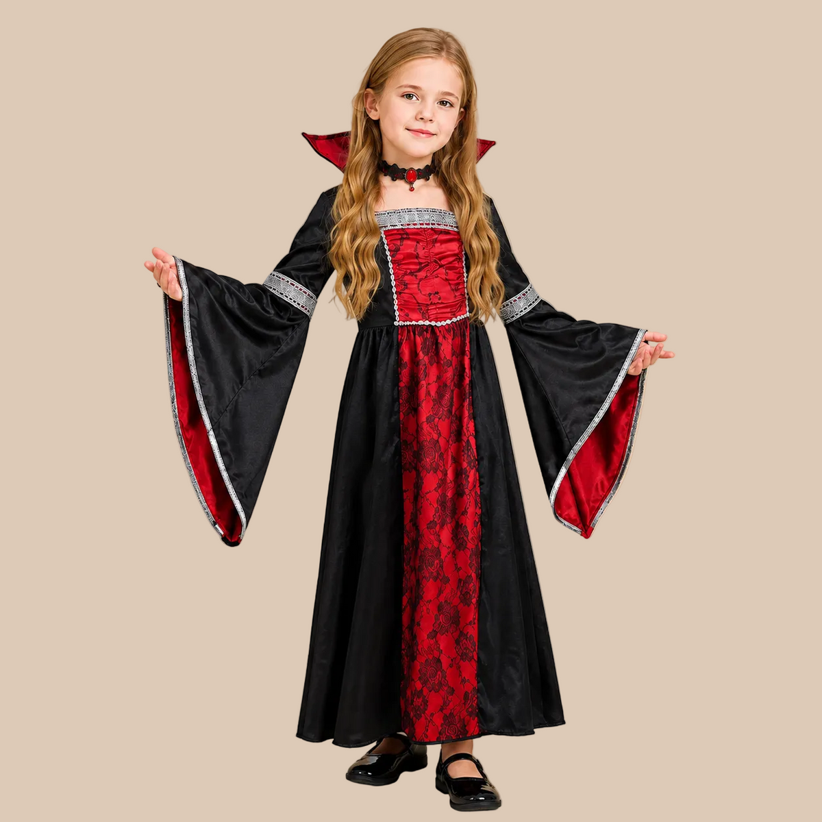 Girl’s long vampire dress with contrasting red front panel, sleeves shown spread out