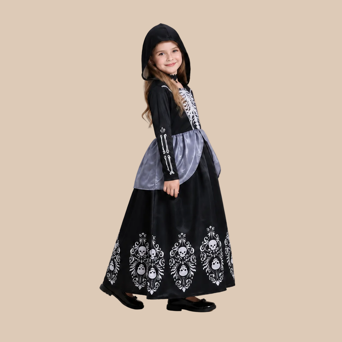 Girl’s hooded skeleton dress with patterned skirt, side view