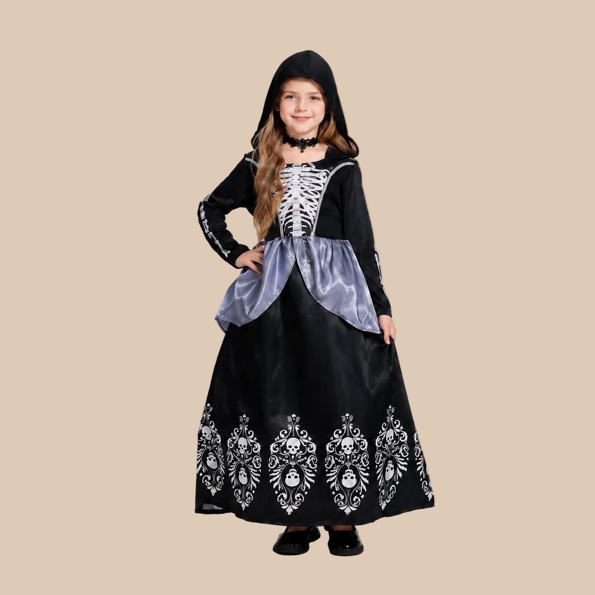 Girl’s hooded skeleton dress with patterned skirt, front view