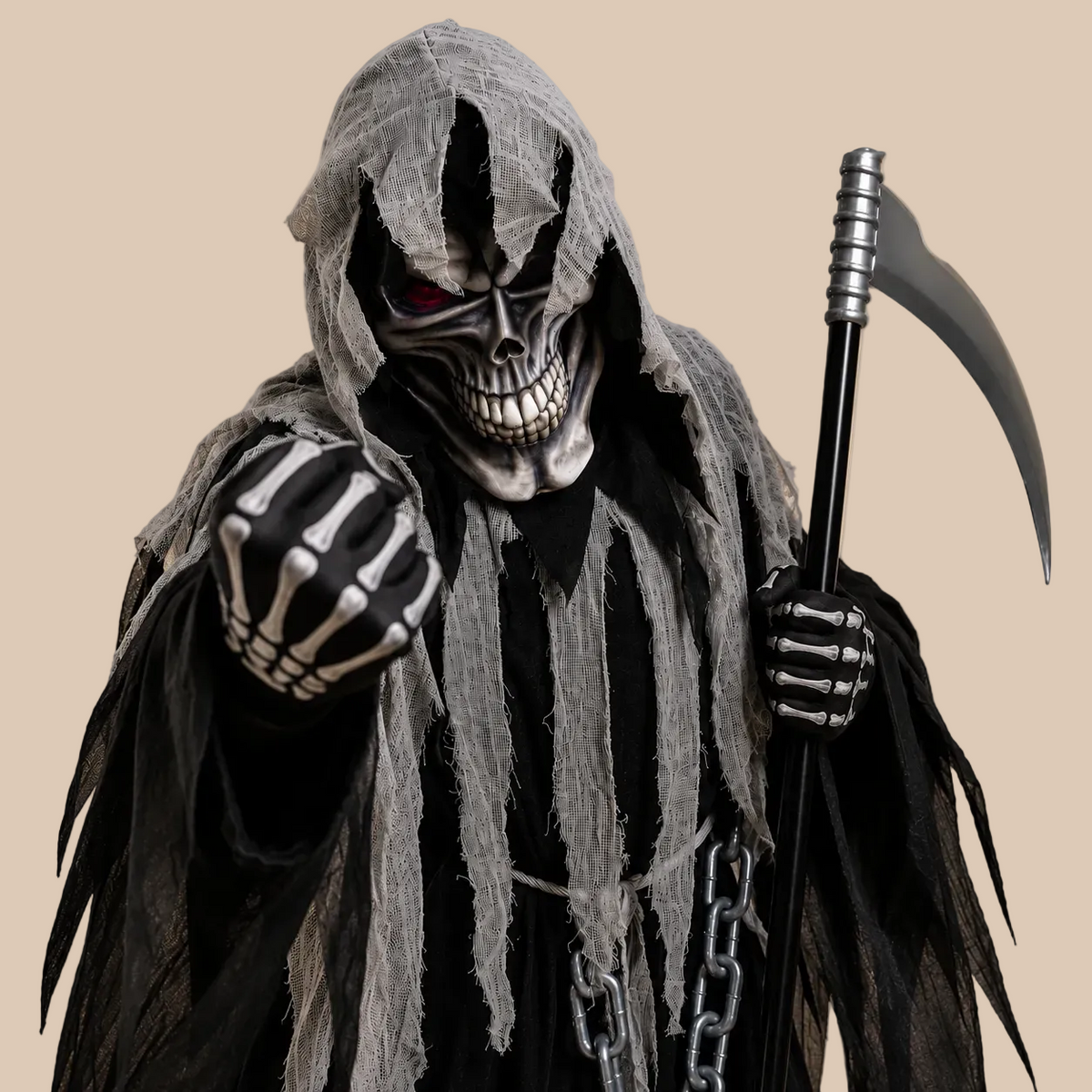 Child’s black hooded reaper costume with ragged grey panels, close-up view