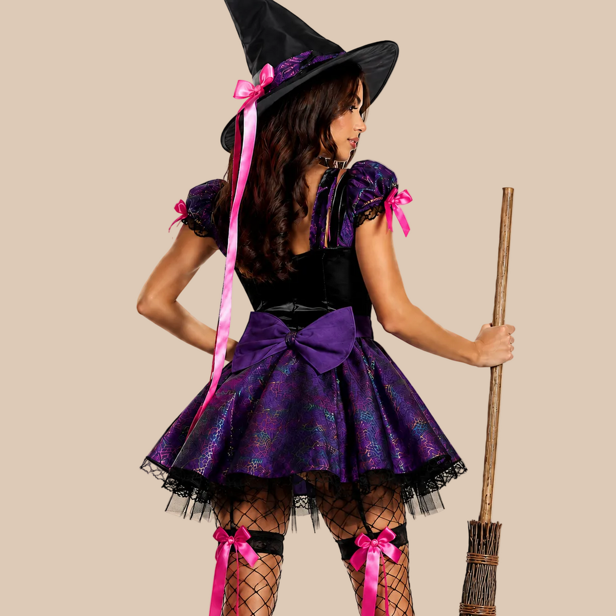 Women’s purple witch dress with pink bows and front lacing, back view