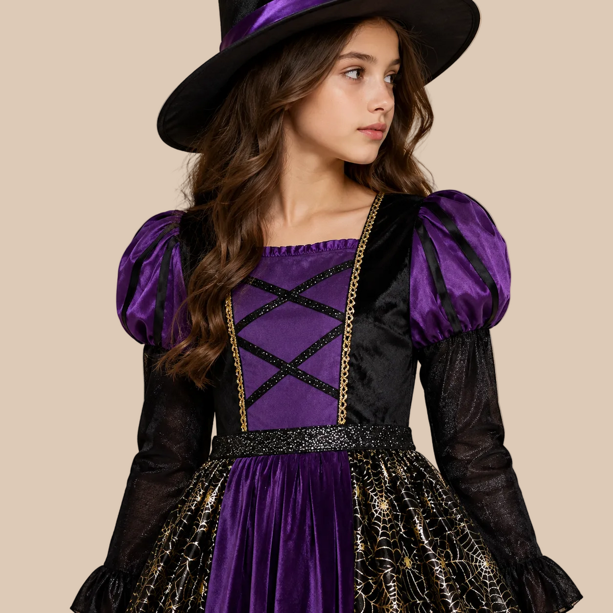 Girl’s purple witch dress with patterned sheer skirt panels, bodice details