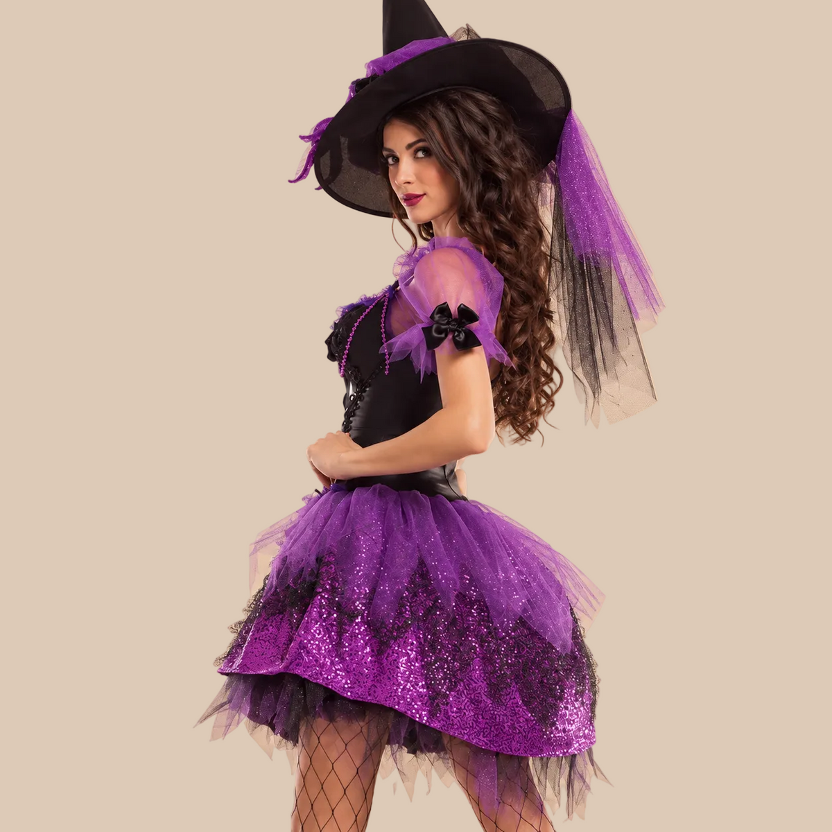 Women’s purple glittery witch dress with a laced bodice, side view