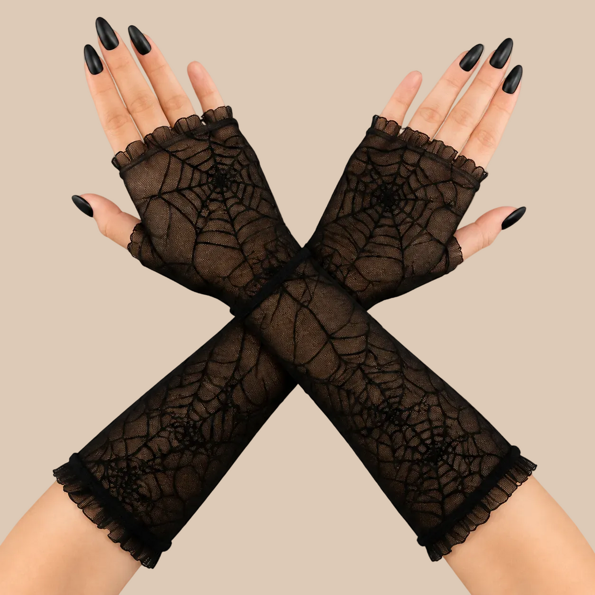 Black fingerless lace gloves with a spiderweb pattern, shown on crossed hands